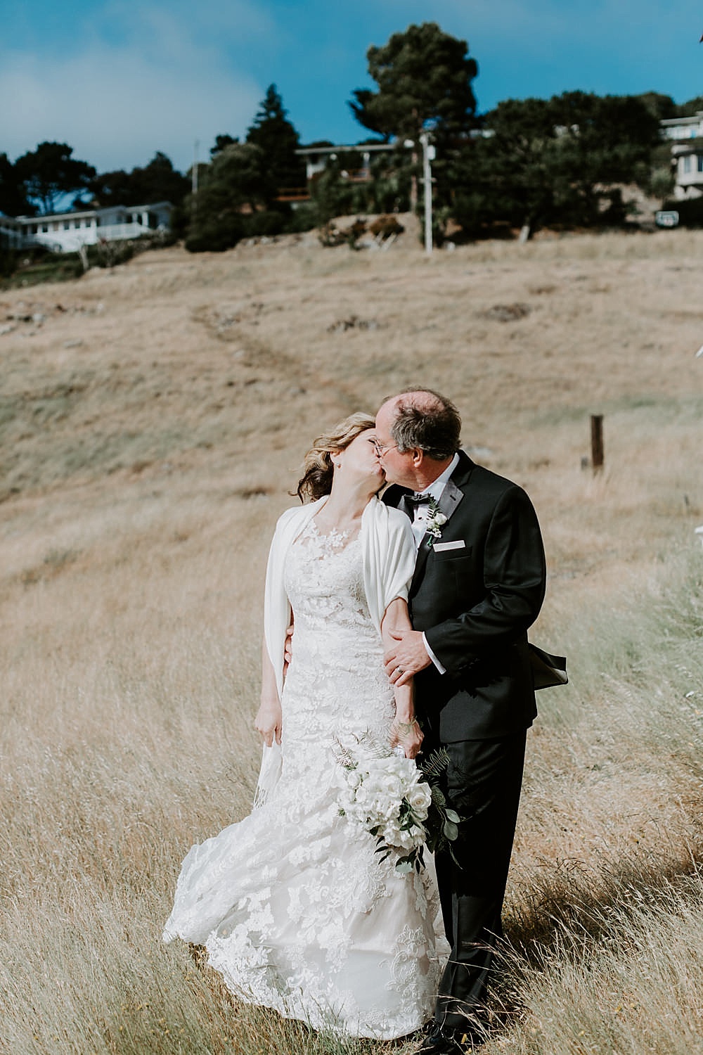 bride and groom kissing outside at their marin wedding by amy thompson photography