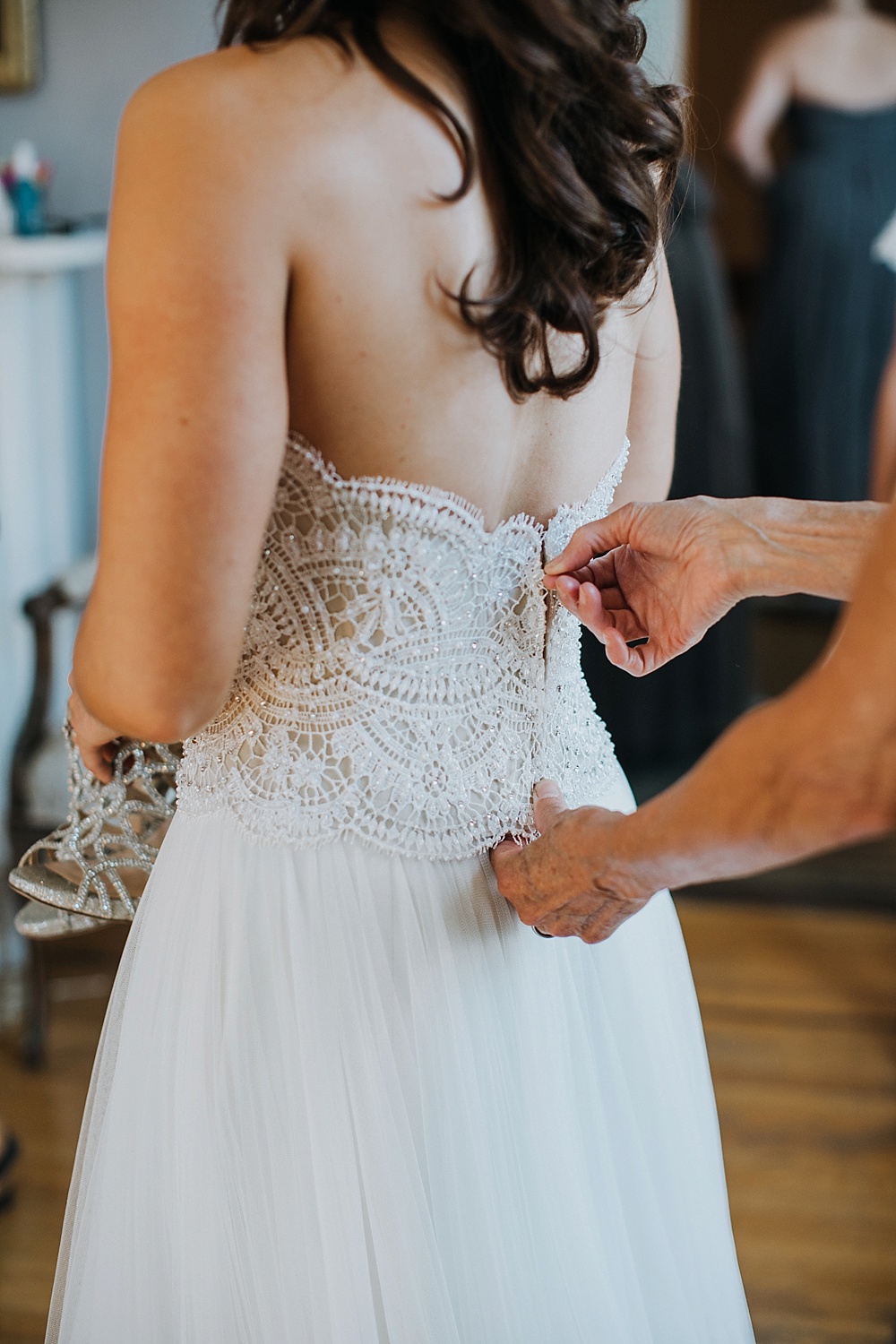 Wedding dress being zipped up at Elks Lodge San Rafael Wedding by Amy Thompson Photography