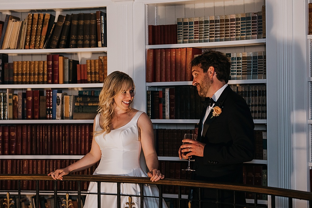 Bride and groom joke during speeches at the fairmont san francisco wedding by amy thompson photography 