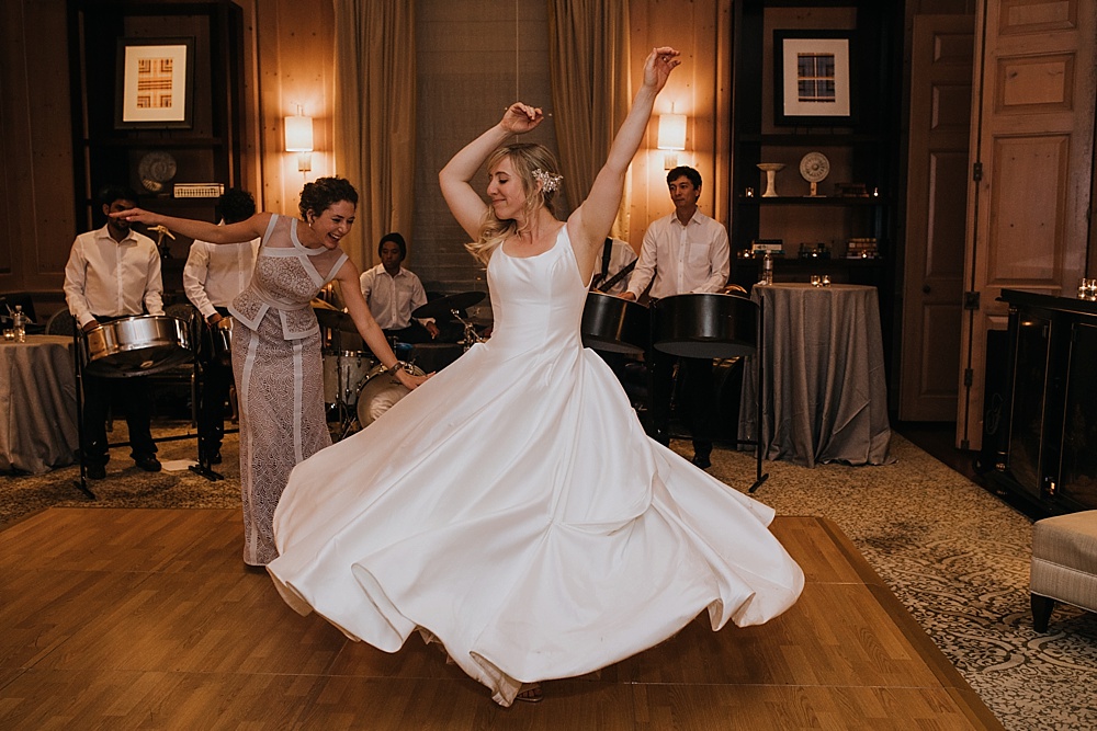 Bride twirls in dress at the fairmont san francisco wedding by amy thompson photography