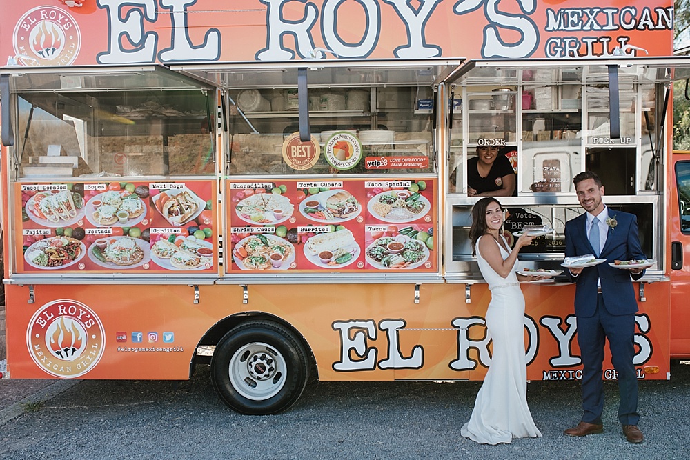 El Roy's tacos being eaten by bride and groom at a Bloomfield farms wedding by amy thompson photography