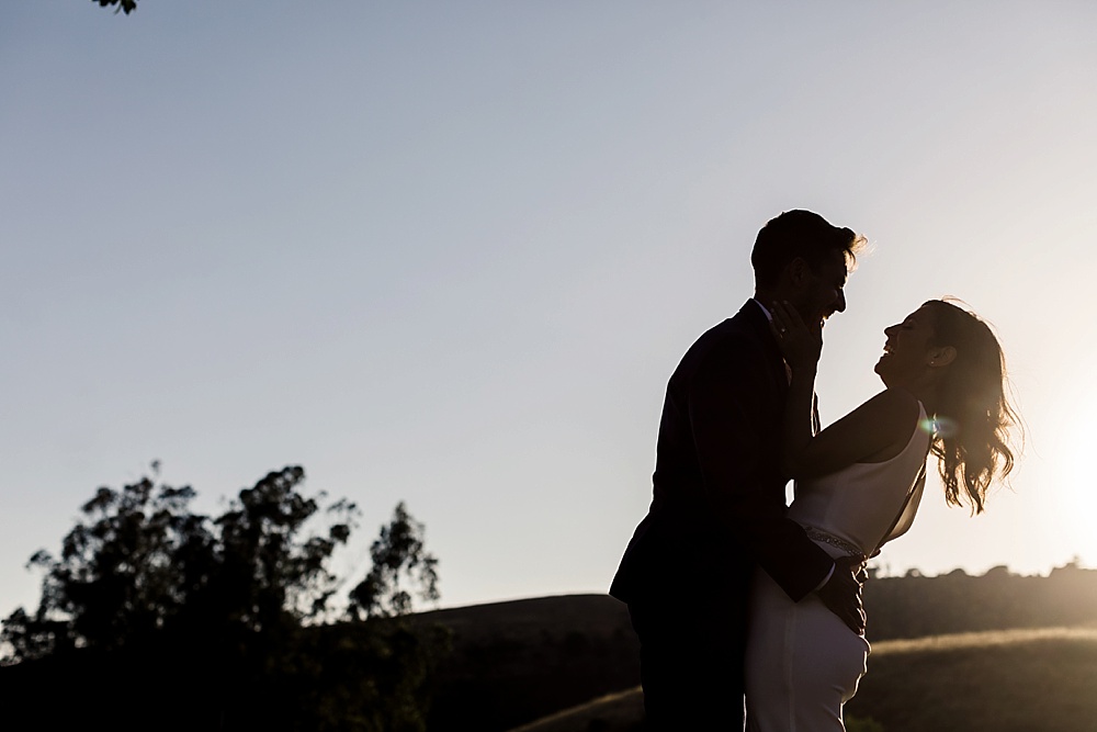 sunset portrait of bride and groom at a Bloomfield farms wedding by amy thompson photography