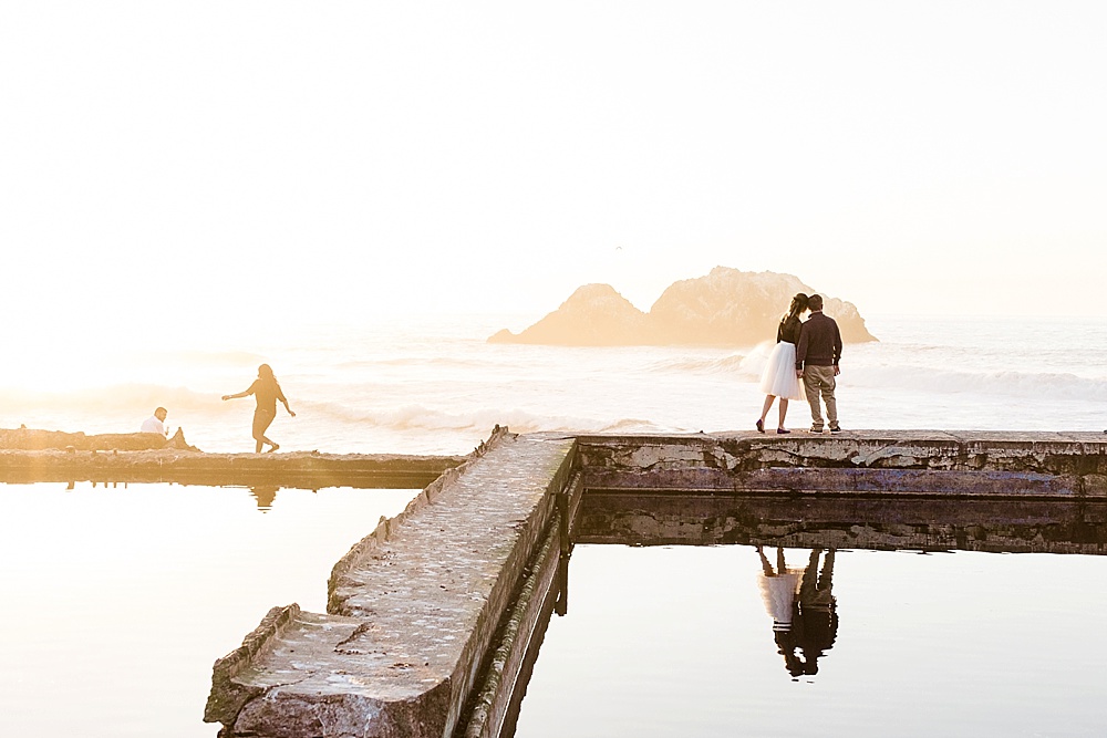 Couple pose by ocean for San Francisco Engagement Locations by amy thompson photography