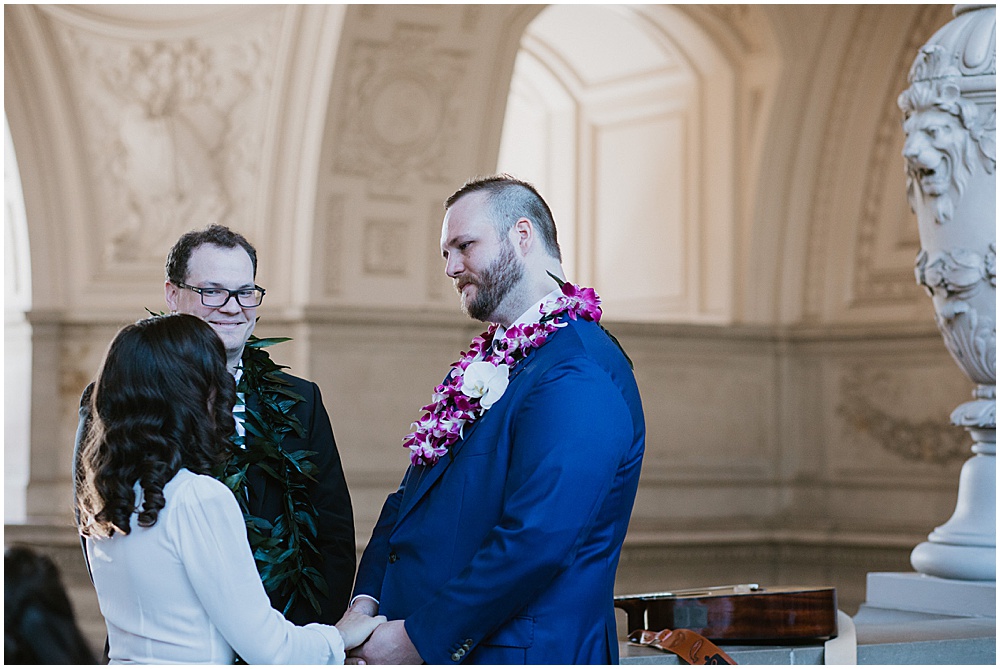 Groom listens as his bride sings during San Francisco City Hall Wedding Ceremony