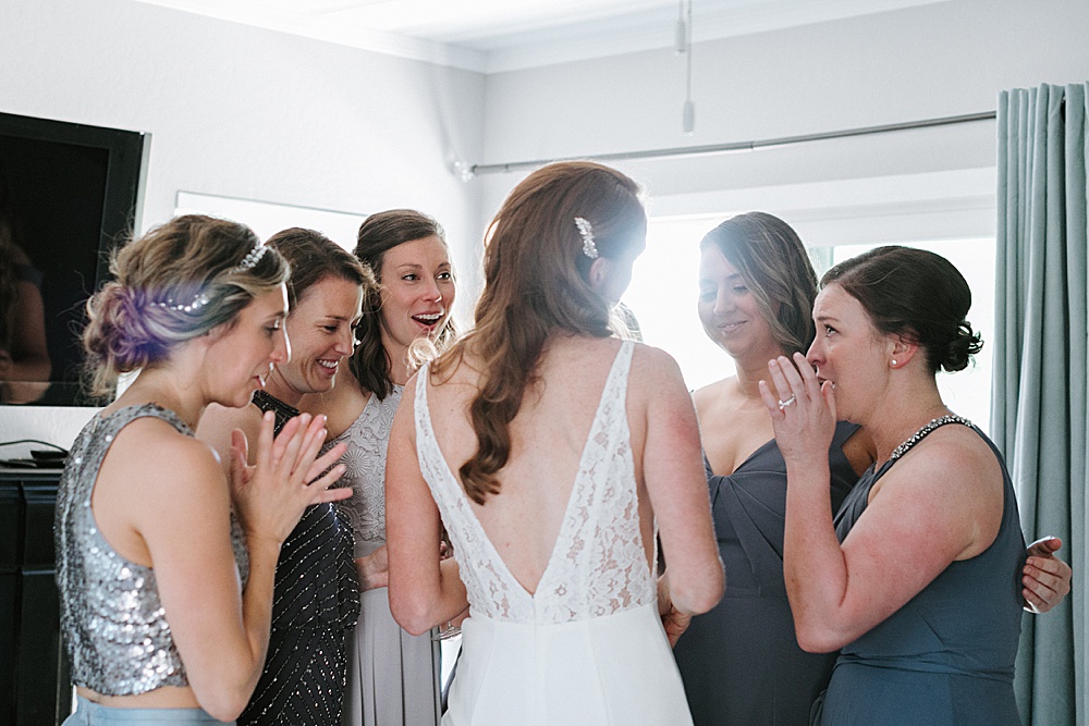 bridesmaids gush over final look of bride at Rosewood Events by amy thompson photography