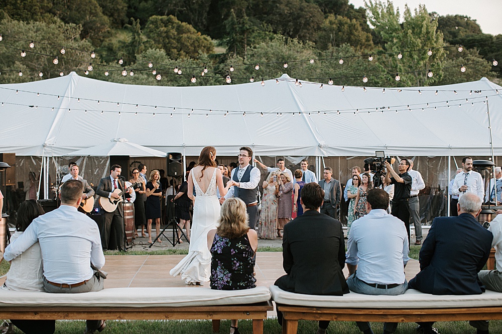 bride and groom dance at Rosewood Events by amy thompson photography with guests watching