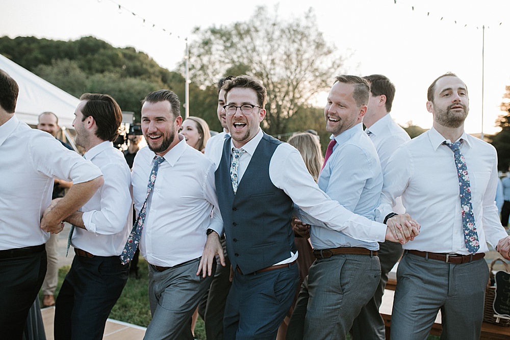 groups shot of groomsmen dancing at Rosewood Events by amy thompson photography
