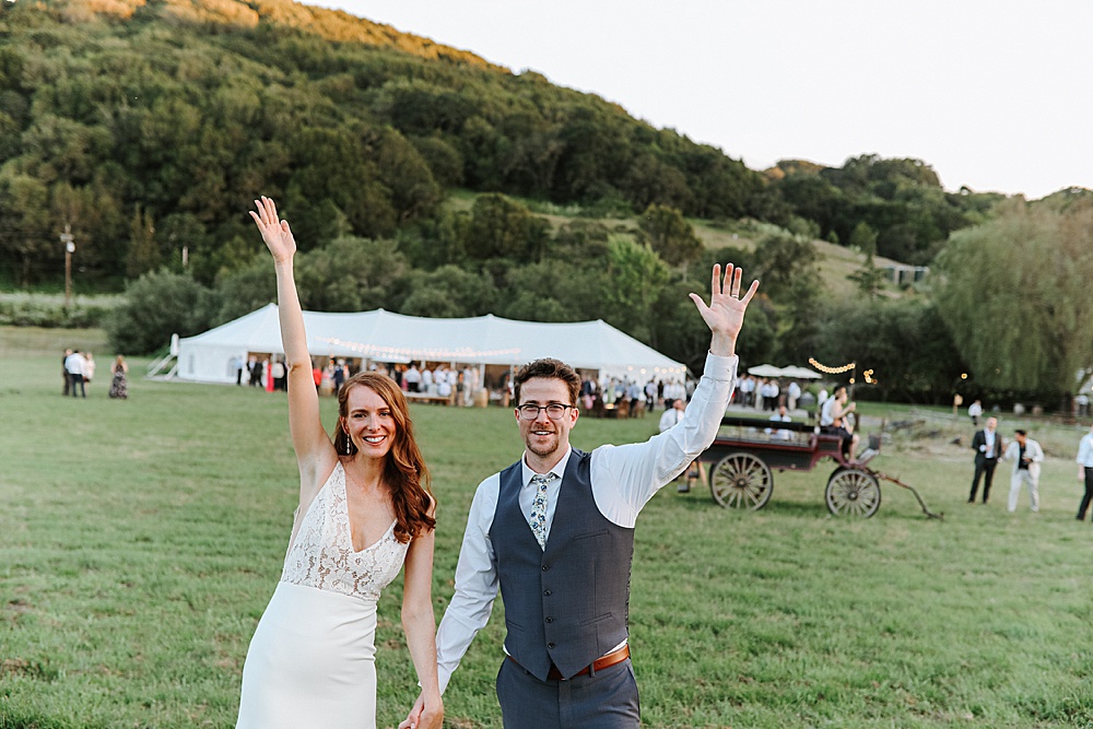 happt bride and groom outside of tent at Rosewood Events by amy thompson photography