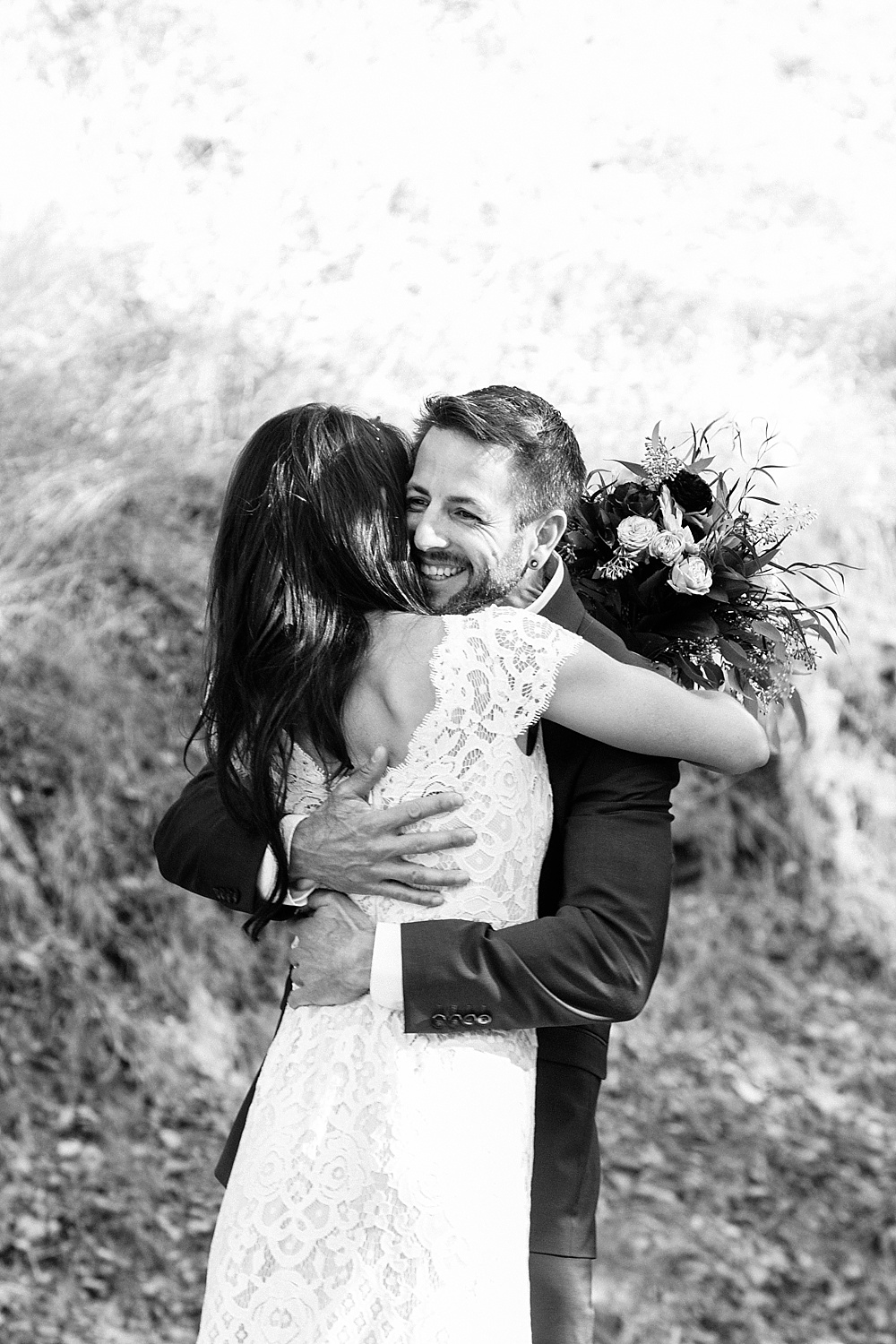 Black and white of bride and groom hugging at Marin County wedding by amy thompson photography