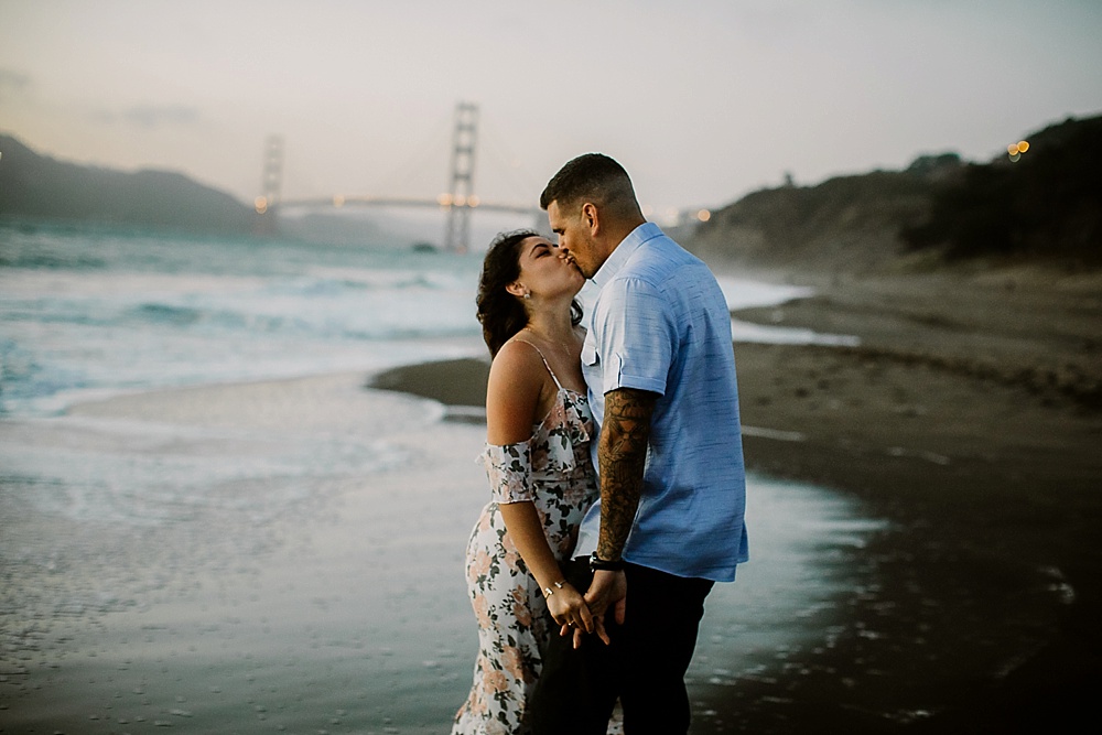 Couple kiss at Baker Beach San Francisco Engagement Locations by amy thompson photography