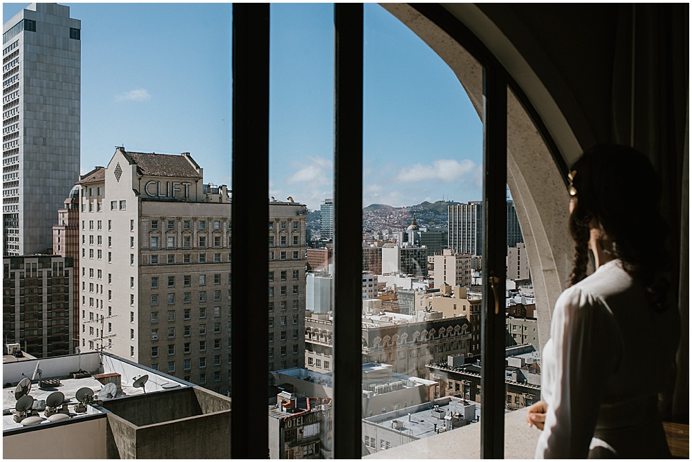 Bride looks out before San Francisco City Hall Wedding Ceremony by amy thompson photography