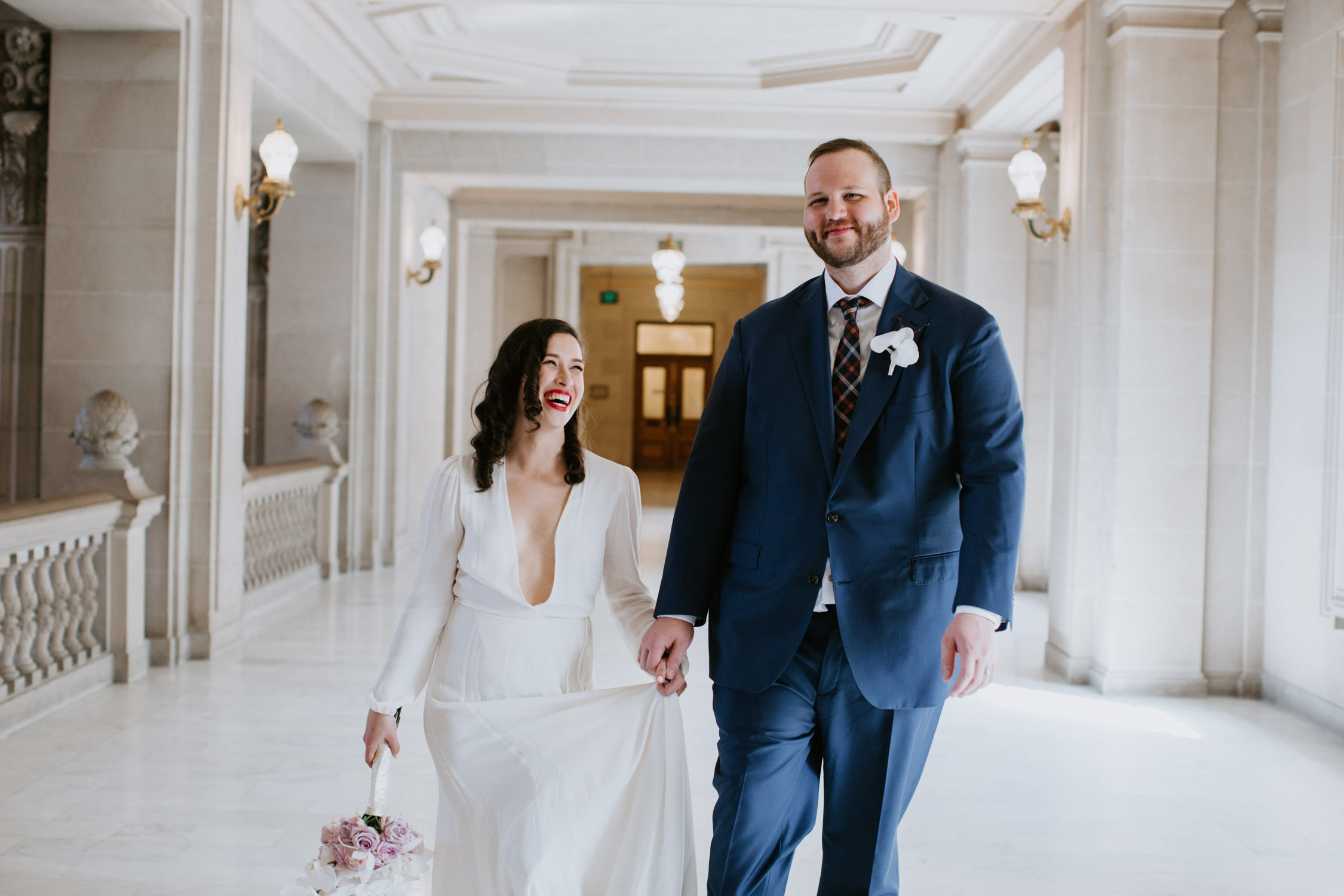 Bride and groom laugh after San Francisco City Hall Wedding Ceremony